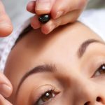 applying of vitamin treatment for facial skin in the beauty salon